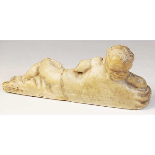 107 - A carved marble fragment depicting a reclining putto with draped material, 22cm long, 10cm high (at ... 