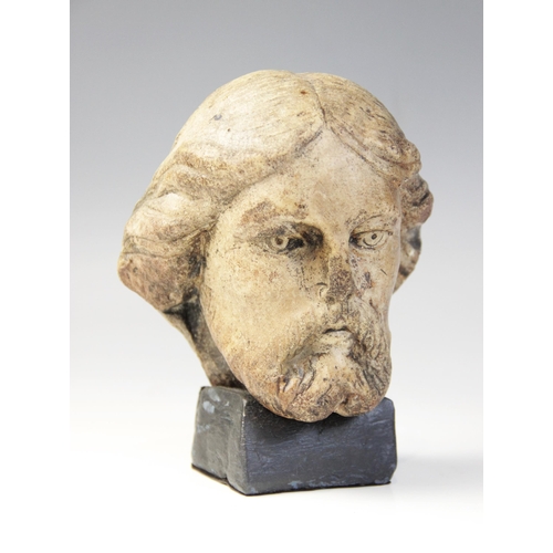 110 - A carved marble male head possibly Christ, modelled with detailed hair and beard, 11.5cm high, set t... 