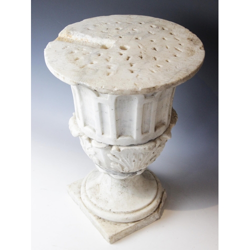 116 - A marble plinth, the urn base with relief carved acanthus leaves to body upon a stepped spreading fo... 