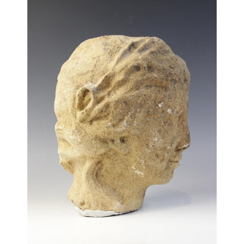 164 - A carved stone head in the classical manner, possibly Venus, with flowing hair, 26cm high (at fault)