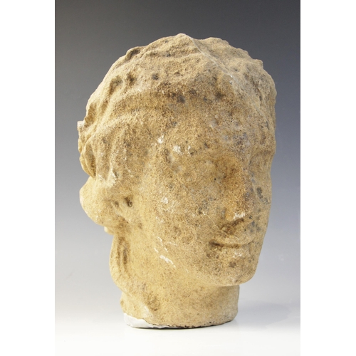 164 - A carved stone head in the classical manner, possibly Venus, with flowing hair, 26cm high (at fault)