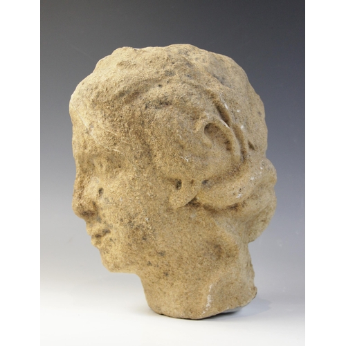 164 - A carved stone head in the classical manner, possibly Venus, with flowing hair, 26cm high (at fault)