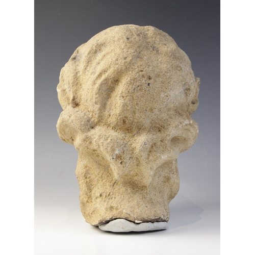 164 - A carved stone head in the classical manner, possibly Venus, with flowing hair, 26cm high (at fault)