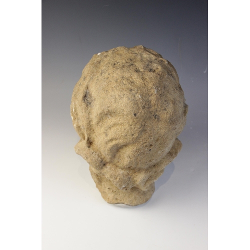 164 - A carved stone head in the classical manner, possibly Venus, with flowing hair, 26cm high (at fault)