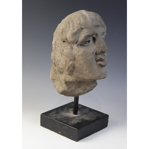 166 - A carved stone male head, 26.5cm high, mounted upon a rod and square plinth base, overall 37.5cm hig... 