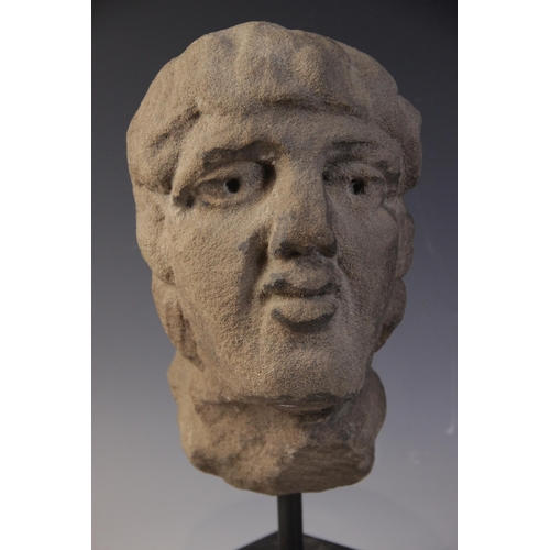 166 - A carved stone male head, 26.5cm high, mounted upon a rod and square plinth base, overall 37.5cm hig... 