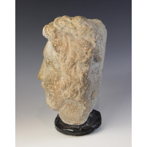 167 - A carved stone female head, in the classical manner, upon later base, 29cm high (at fault)