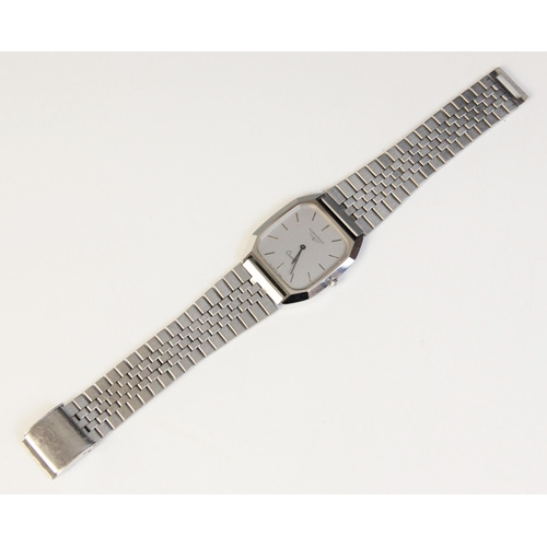 22 - * A Longines Quartz wristwatch, the stainless steel rectangular case with silvered face and baton di... 