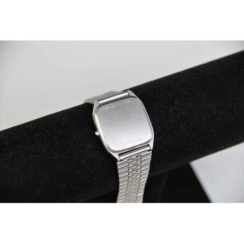 22 - * A Longines Quartz wristwatch, the stainless steel rectangular case with silvered face and baton di... 