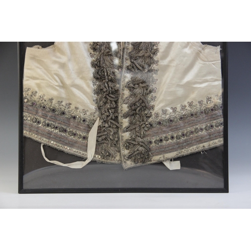 261 - A late 18th/early 19th century ivory silk satin waistcoat, decorated in silver coloured and gilt bro... 