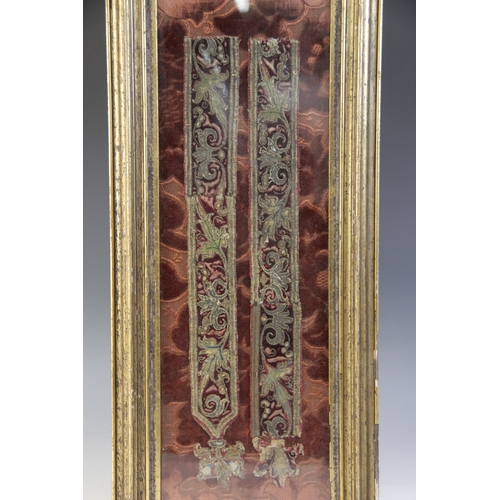 266 - A part sword hanger, possibly 17th century, in crimson velvet with scrolling decoration in polychrom... 