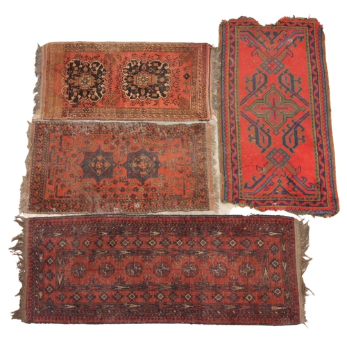 276 - Four assorted small Persian pattern hand knotted wool rugs, each with multiple gulls upon a red grou... 