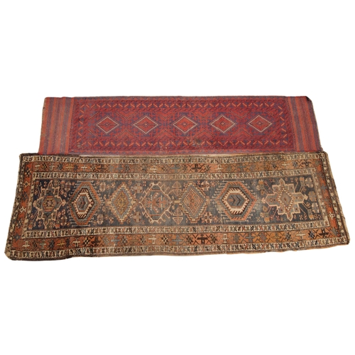 277 - A Turkish hand knotted wool runner, in colourways of red and blue, the central panel with five lozen... 