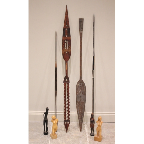 287 - * An African tribal hardwood ceremonial paddle, the leaf shaped pierced blade carved with lizards an... 