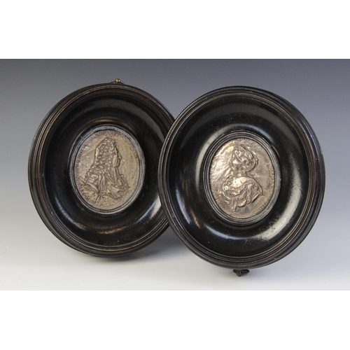 30 - A pair of silver coloured William & Mary commemorative plaques, 18th Century, depicting repoussé pro... 