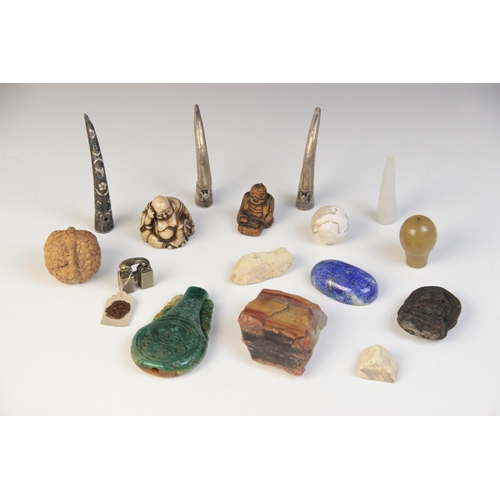 301 - * A selection of Chinese and Eastern objects of virtue, to include a pale jade nail guard, with carv... 