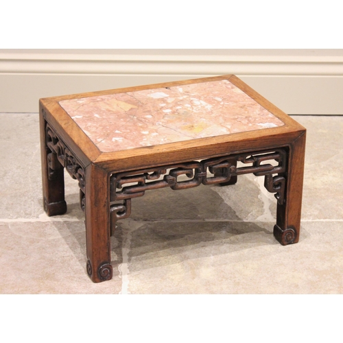 304 - A Chinese hardwood and rouge marble urn stand, of rectangular form with interlinked openwork frieze,... 