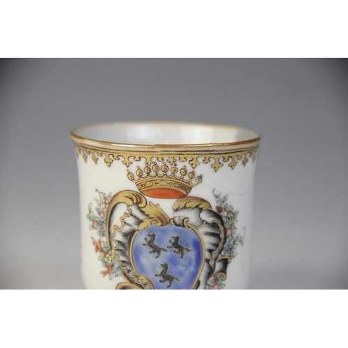 305 - An 18th century Chinese export armorial porcelain teacup and saucer (Qianlong 1735–1796), the teacup... 