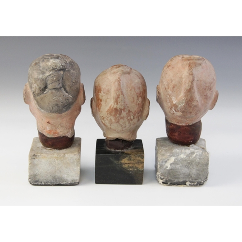 314 - Three Chinese terracotta heads, possibly Han dynasty, each buff glazed exterior with moulded feature... 