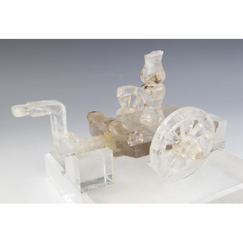 316 - A Chinese rock crystal model of a carriage, the rectangular platform supported by two circular wheel... 