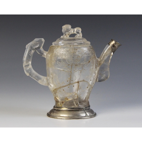 319 - A Chinese carved rock crystal teapot and cover, the bamboo moulded handle adjoined to a body carved ... 