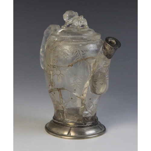 319 - A Chinese carved rock crystal teapot and cover, the bamboo moulded handle adjoined to a body carved ... 