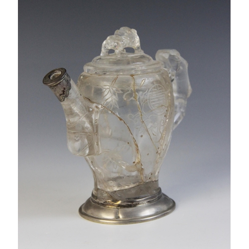 319 - A Chinese carved rock crystal teapot and cover, the bamboo moulded handle adjoined to a body carved ... 