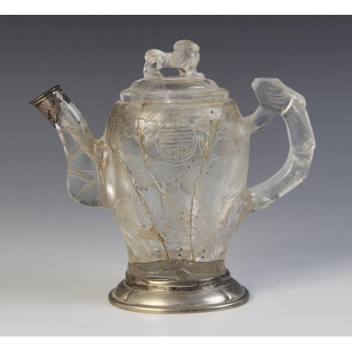 319 - A Chinese carved rock crystal teapot and cover, the bamboo moulded handle adjoined to a body carved ... 