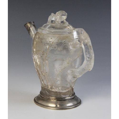 319 - A Chinese carved rock crystal teapot and cover, the bamboo moulded handle adjoined to a body carved ... 