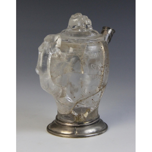 319 - A Chinese carved rock crystal teapot and cover, the bamboo moulded handle adjoined to a body carved ... 