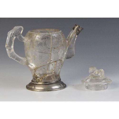 319 - A Chinese carved rock crystal teapot and cover, the bamboo moulded handle adjoined to a body carved ... 