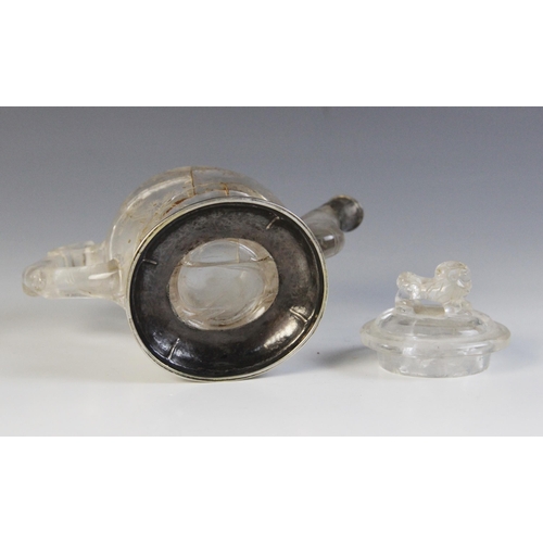 319 - A Chinese carved rock crystal teapot and cover, the bamboo moulded handle adjoined to a body carved ... 