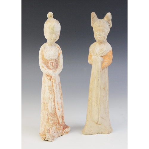 325 - Two Chinese pottery figures of female courtesans, possibly Sui/Tang dynasty, each modelled standing ... 