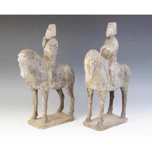 329 - Two Chinese pottery figures on horseback, possibly Tang dynasty, each horse modelled on four legs up... 