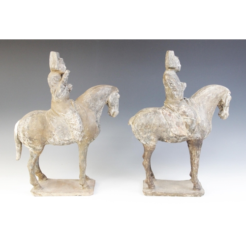 329 - Two Chinese pottery figures on horseback, possibly Tang dynasty, each horse modelled on four legs up... 