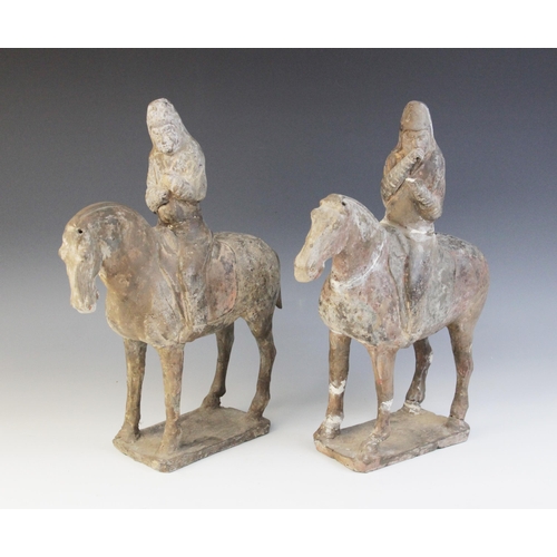 330 - Two Chinese pottery figures on horseback, possibly Tang dynasty, each horse modelled on four legs up... 