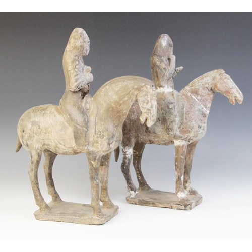 330 - Two Chinese pottery figures on horseback, possibly Tang dynasty, each horse modelled on four legs up... 