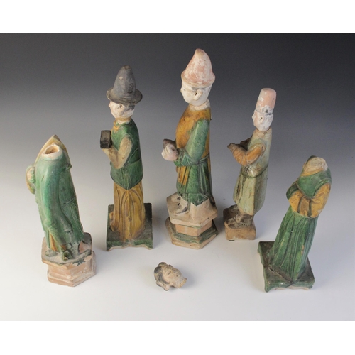 345 - Five Chinese Sancai glazed attendants, possibly Ming dynasty or later, each glazed in green and yell... 