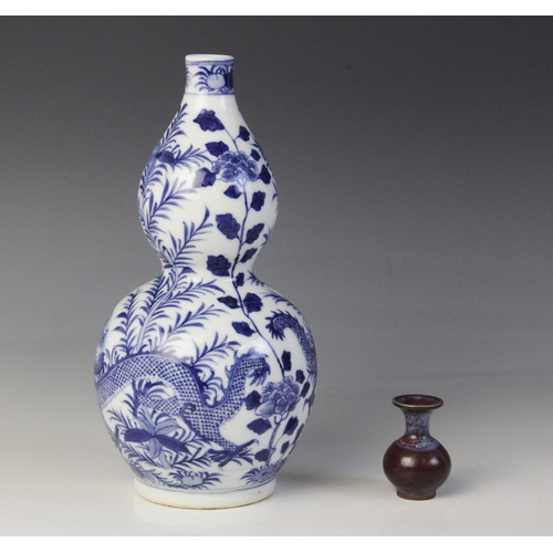 348 - * A Chinese porcelain blue and white gourd vase, 19th century, of double gourd form and externally d... 