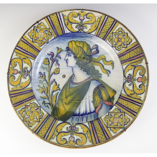 364 - An Italian majolica charger, 19th century, decorated in typical colours with a profile portrait agai... 