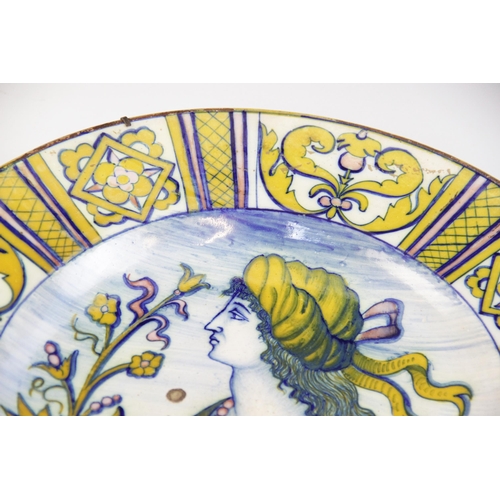 364 - An Italian majolica charger, 19th century, decorated in typical colours with a profile portrait agai... 