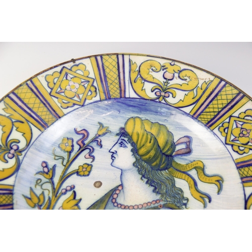 364 - An Italian majolica charger, 19th century, decorated in typical colours with a profile portrait agai... 