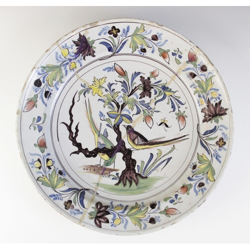 365 - An English Delft charger, 18th century, decorated in the 'Fazackerly' palette, with exotic birds per... 