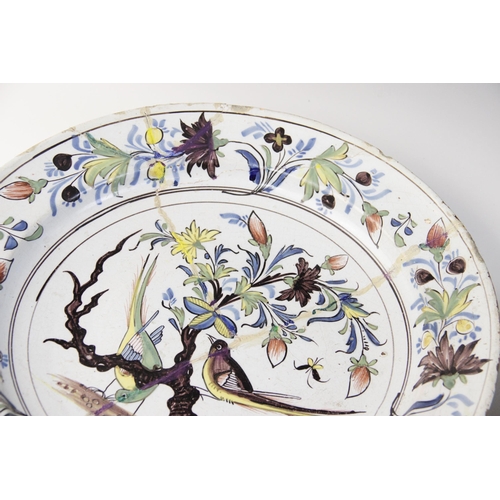 365 - An English Delft charger, 18th century, decorated in the 'Fazackerly' palette, with exotic birds per... 