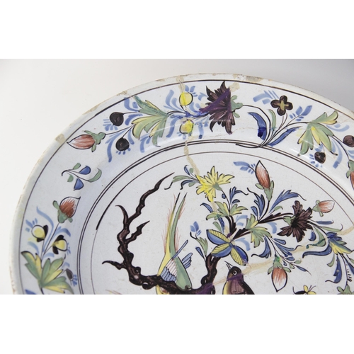 365 - An English Delft charger, 18th century, decorated in the 'Fazackerly' palette, with exotic birds per... 