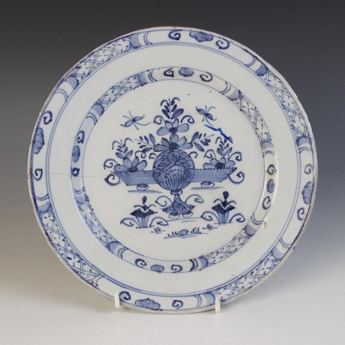 368 - A delft plate dated 1725, blue painted with a central lozenge with four stylised flower heads, initi... 