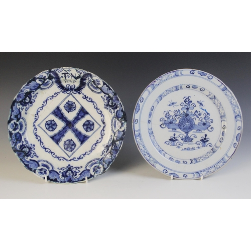 368 - A delft plate dated 1725, blue painted with a central lozenge with four stylised flower heads, initi... 