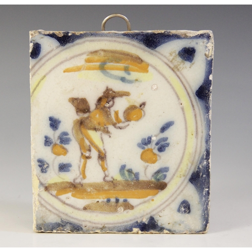 369 - A collection of ten delft tiles, 18th century and later, to include a ship decorated example 13cm x ... 