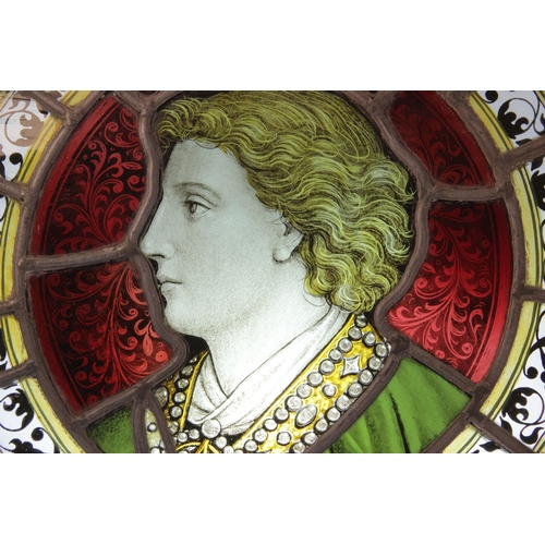 375 - An oval stained and painted glass portrait panel, 19th century, depicting a young gentleman in ornat... 