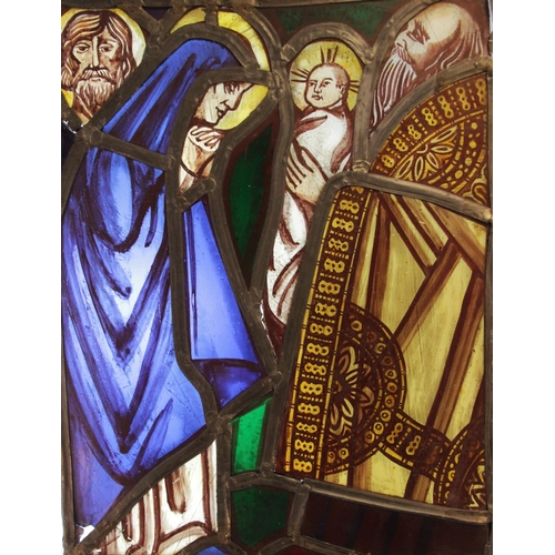 379 - A stained and painted glass panel, 19th century, depicting Mary presenting the infant Jesus to one o... 